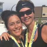 Photograph of Ellen Voorhees and daughter in 2016 upon completion of the Mankato marathon.
