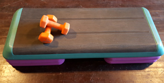picture of dumbells on stepper exercise equipment